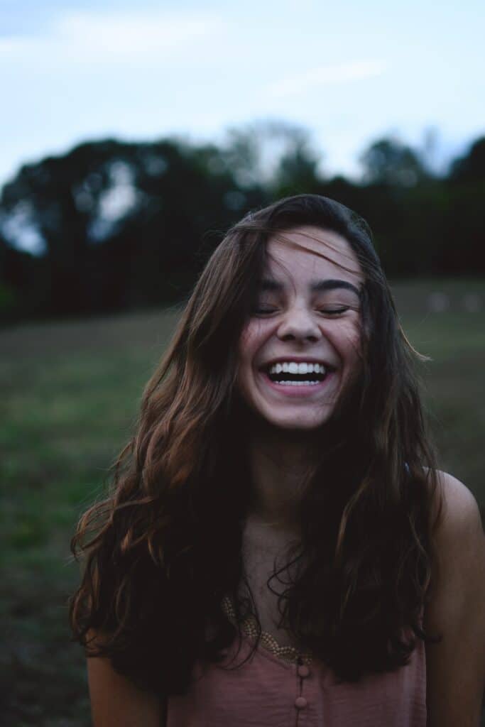 girl smiling happily