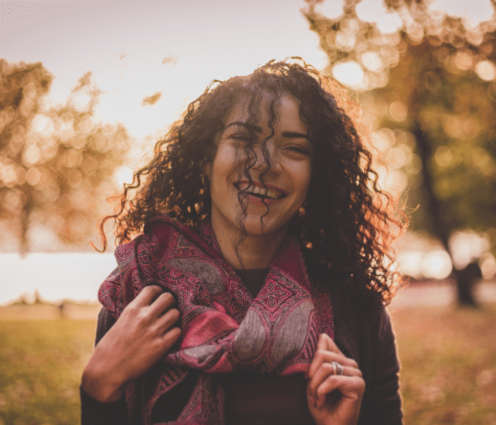 happy smiling woman with curly hair